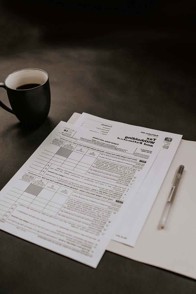 coffee cup black ceramic mug beside white printer paper cup